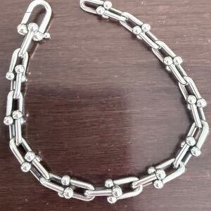 Genuine Tiffany &Co. Sterling Silver Heard Ware bracelet and Oil Charm necklace